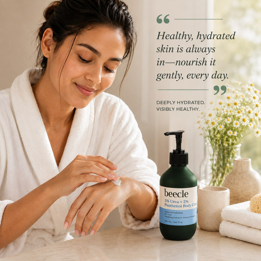 Woman applying lotion with a bottle of beecle product on a table, surrounded by flowers and towels.